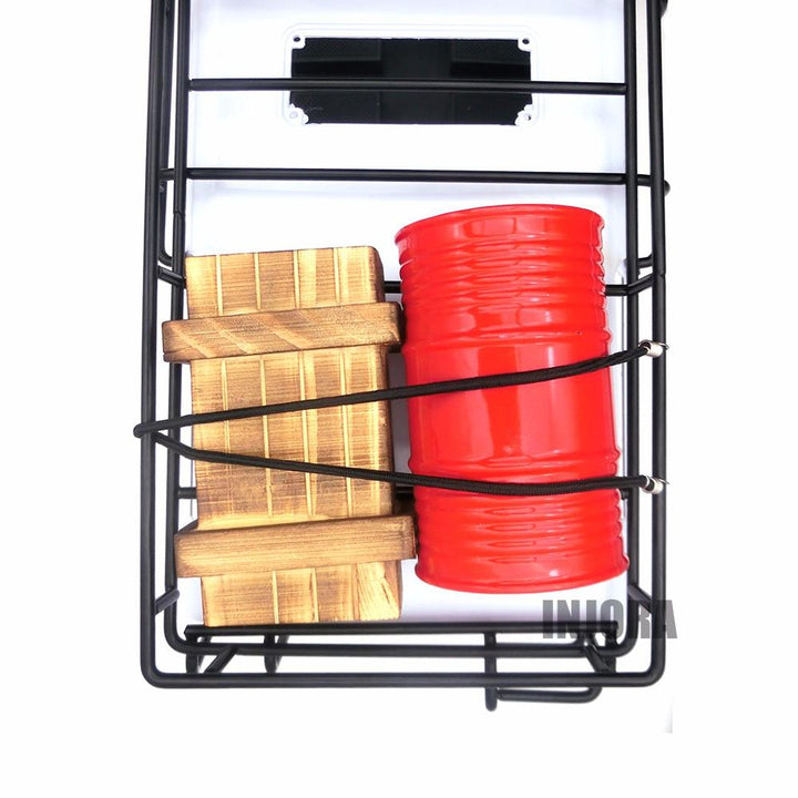 a black rope tied a oil drum and a Wooden box
