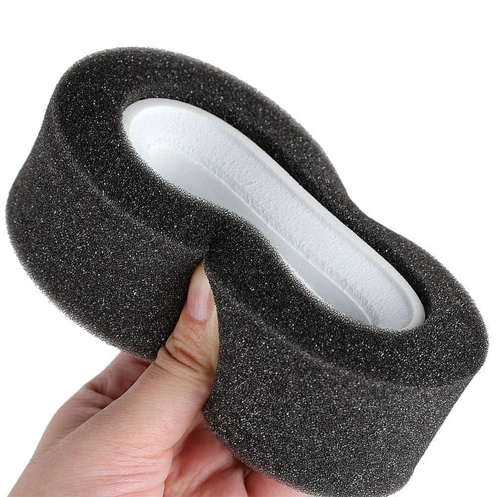 a Grey Sponge Dual Foam flattened by a hand