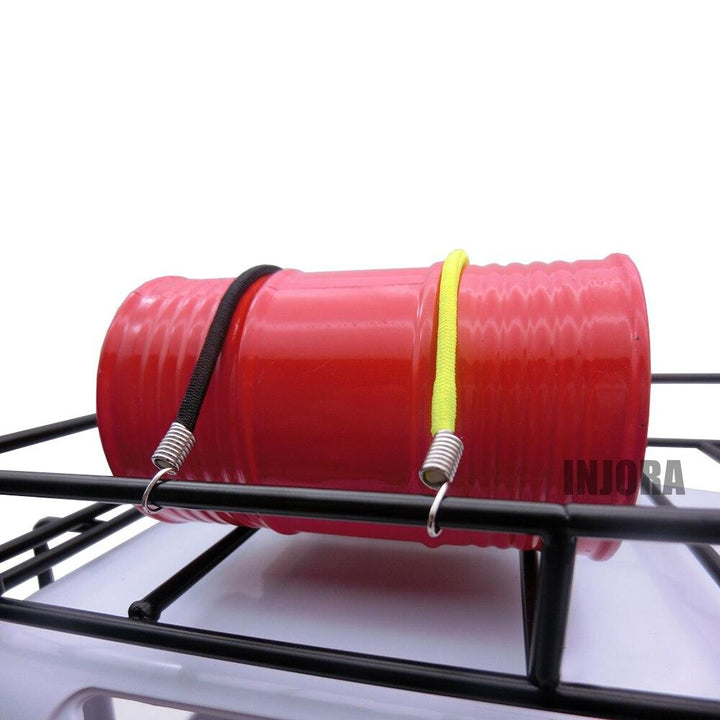 a red oil drum tied by 2 ropes
