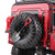 a red rc crawler back, with tire Shovel and jack